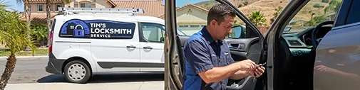 Tim's Locksmith Service technician programming a car key at a vehicle in Camarillo, California. Car key cutting, key programming, ignition replacement, and key fob services for all makes and models across Ventura County.