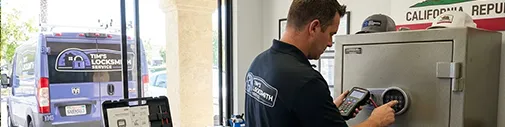 Tim's Locksmith Service technician programming an electronic safe lock at a business in Thousand Oaks, California. Safe opening, combination changes, electronic safe programming, and vault lock services across Ventura County.