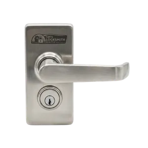 Storefront lever handle being fitted on a glass entry door ahead of a business grand opening at a commercial property in Oceanside, California. Commercial locksmith work scheduled around business hours when needed.