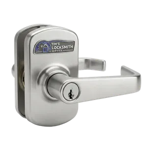 Tim's Locksmith Service installing a commercial lever set during a multi-tenant rekey on an office suite door in Otay Mesa, California. Commercial locksmith work scheduled around business hours when needed.