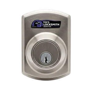 Tim's Locksmith Service rekeying a residential deadbolt following a lost key on the job site at a Carlsbad, California residence. No lock replacement needed when rekeying is an option.