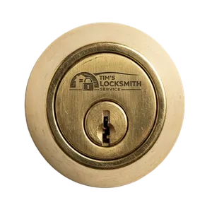 Tim's Locksmith Service rekeying a residential deadbolt during a tenant handover at a Ramona, California residence. Key duplication offered on the same call for extra copies.