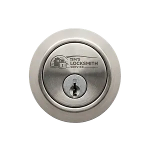Locksmith pinning a deadbolt to a new key during a rekey call during a rental turnover at a home in Rancho Santa Fe, California. Key duplication offered on the same call for extra copies.